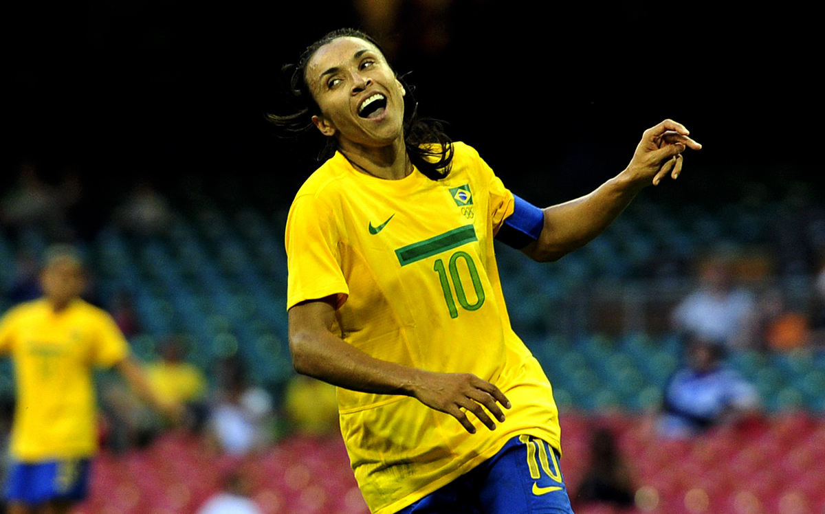 Brazil striker Marta (C) celebrates scor